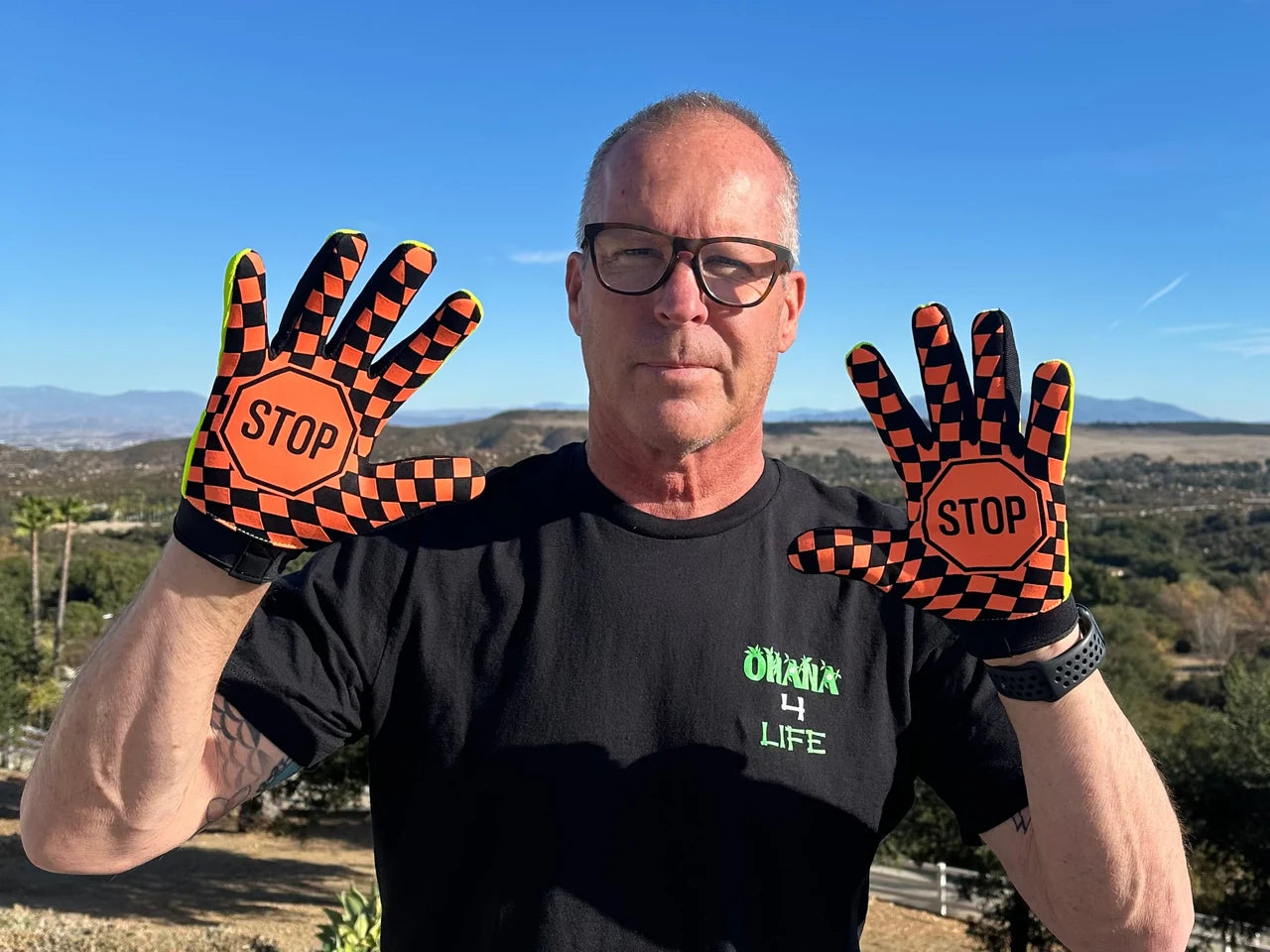 You See Me - Pre Run Gloves — Ricky Johnson showing the current STOP-palm design